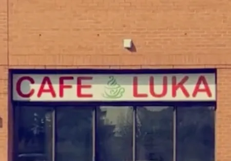 The Café Luka storefront sign above the unit's front windows