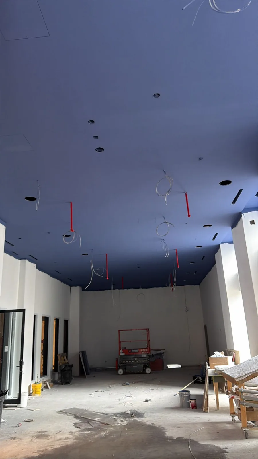 Scissor lift on the floor of the open space used to reach the high ceiling