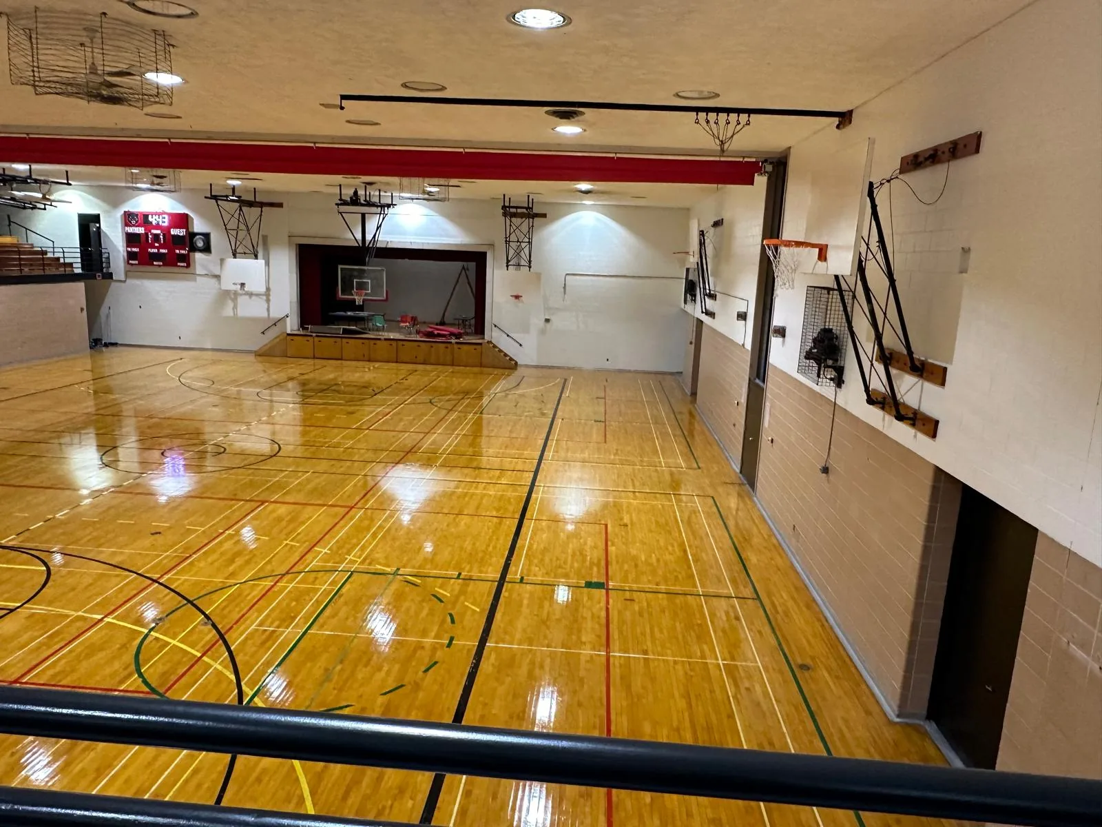 The repainted Dunnville Secondary School gymnasium seen from the balcony, with the hardwood court below