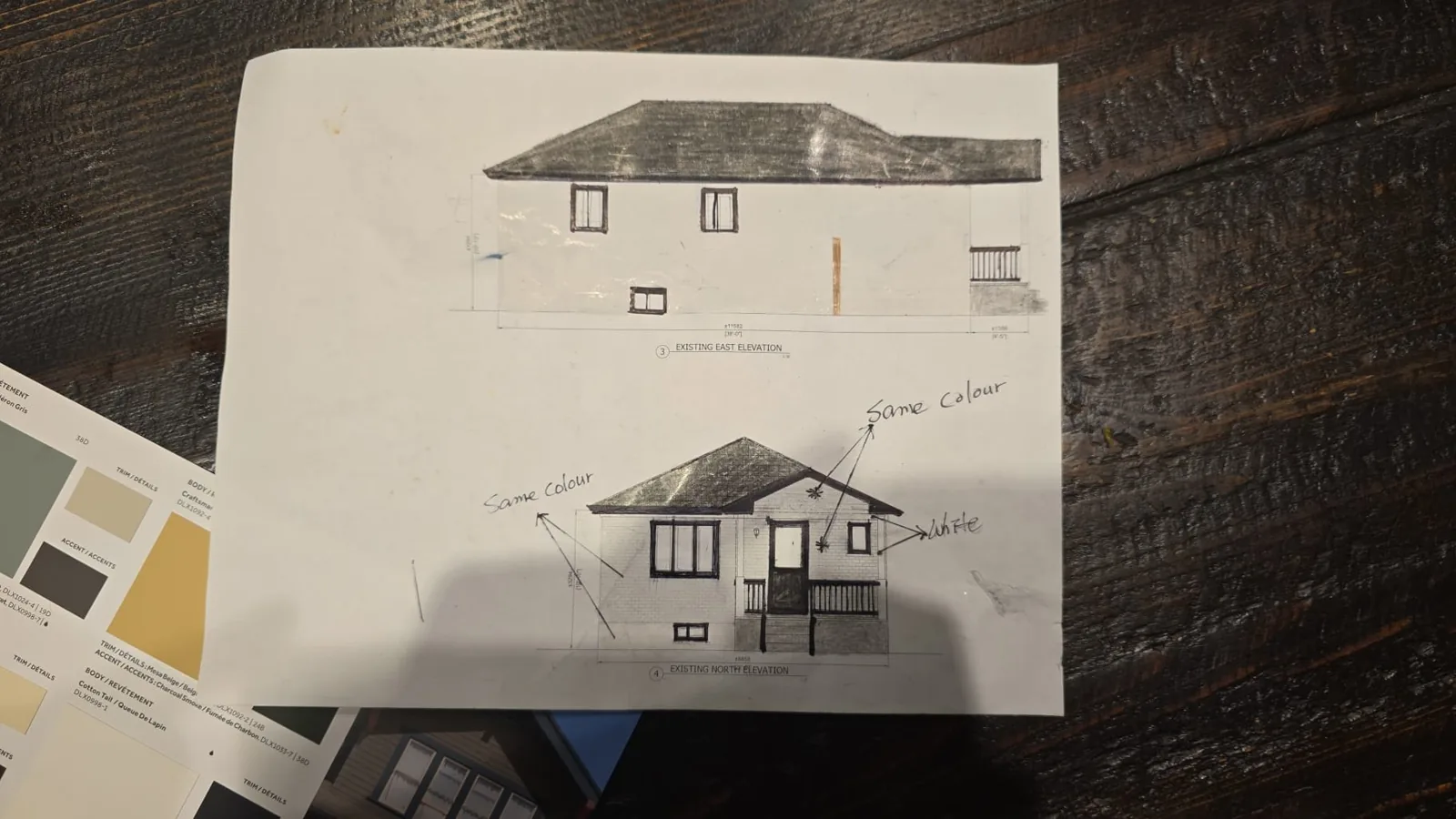 The front and side elevation drawings of the house, marked up by hand by FAIME to show where each colour would go, beside colour samples