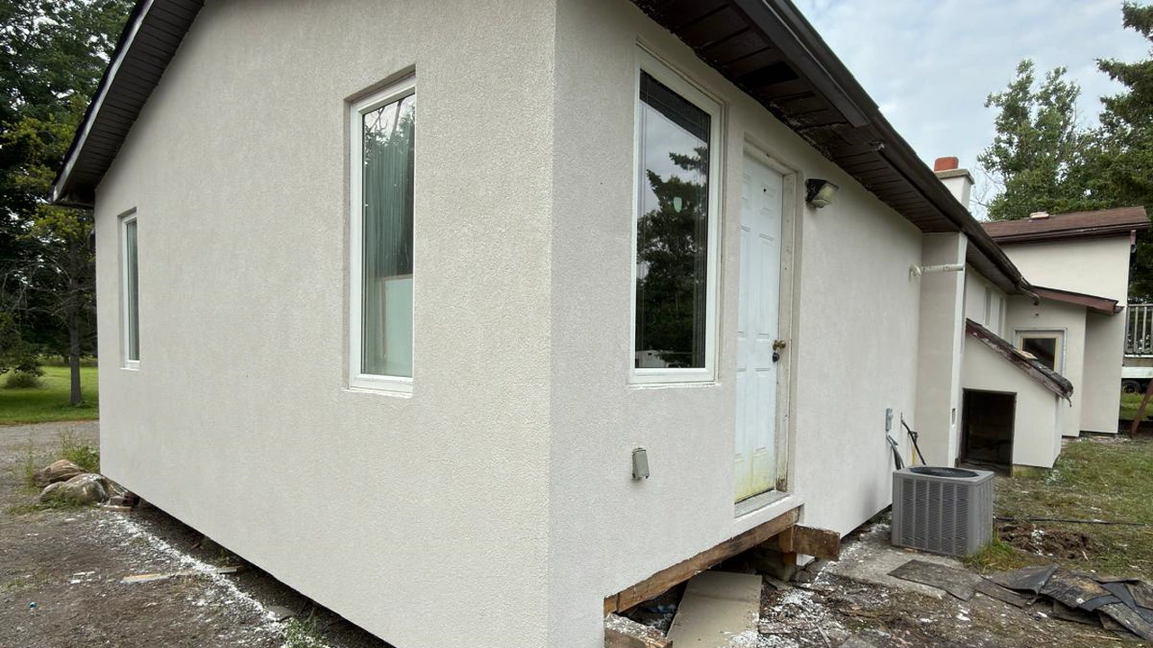 An Innisfil bungalow after a full exterior EIFS transformation by FAIME Construction, finished in a flat textured coat