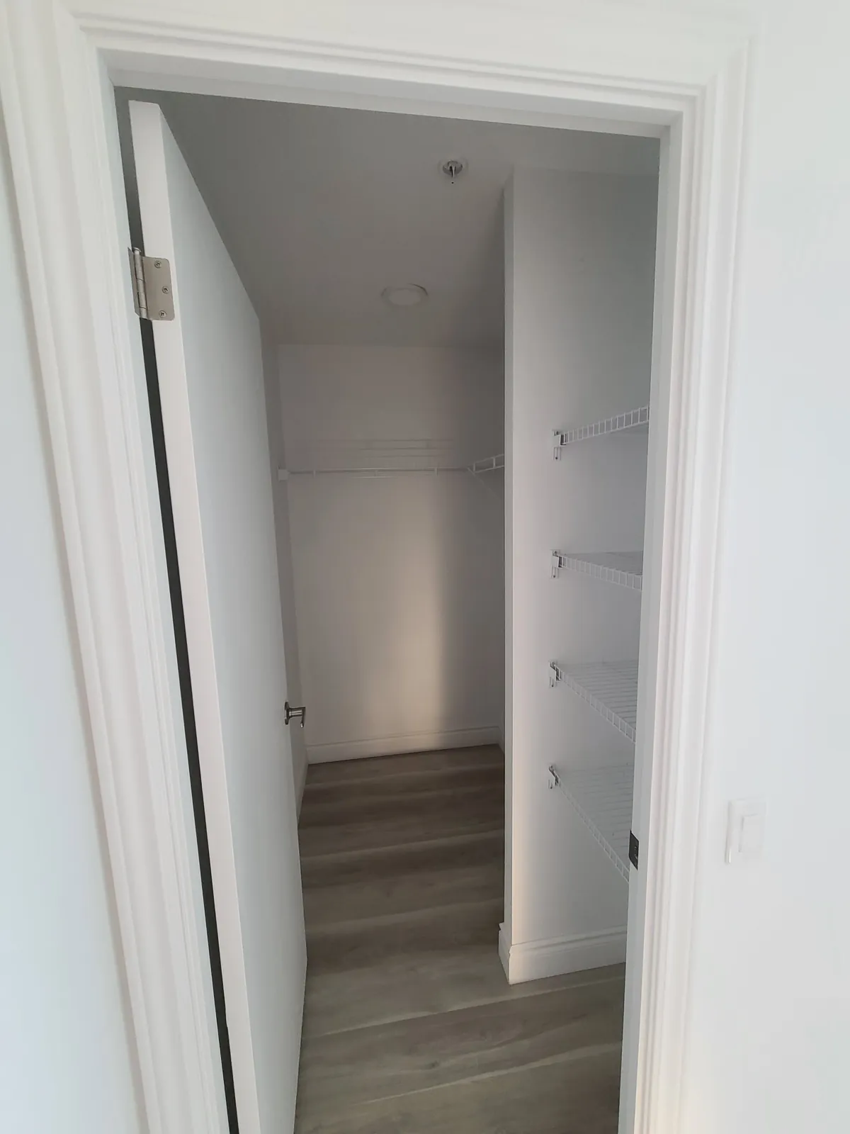 A suite closet and door with semi-gloss trim
