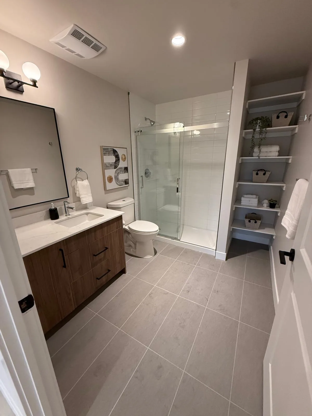 A suite bathroom with painted walls and ceiling above the vanity and glass shower