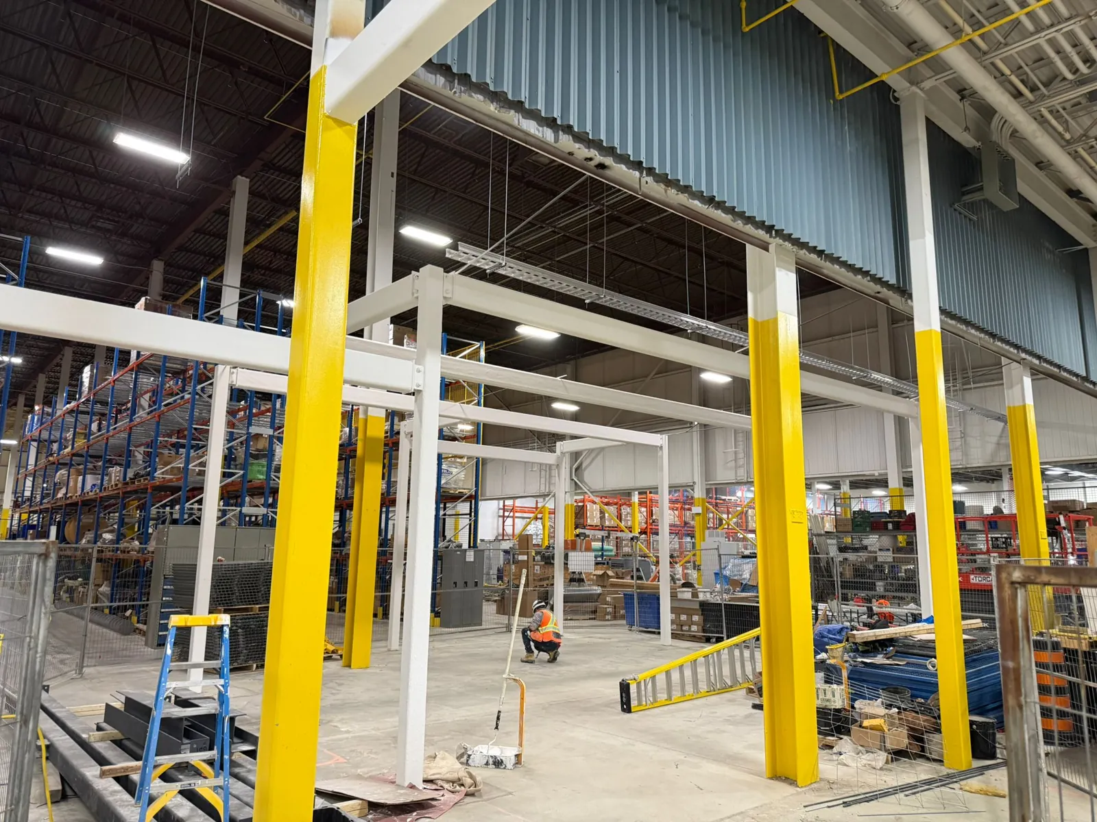 A row of coated columns and beams in the warehouse