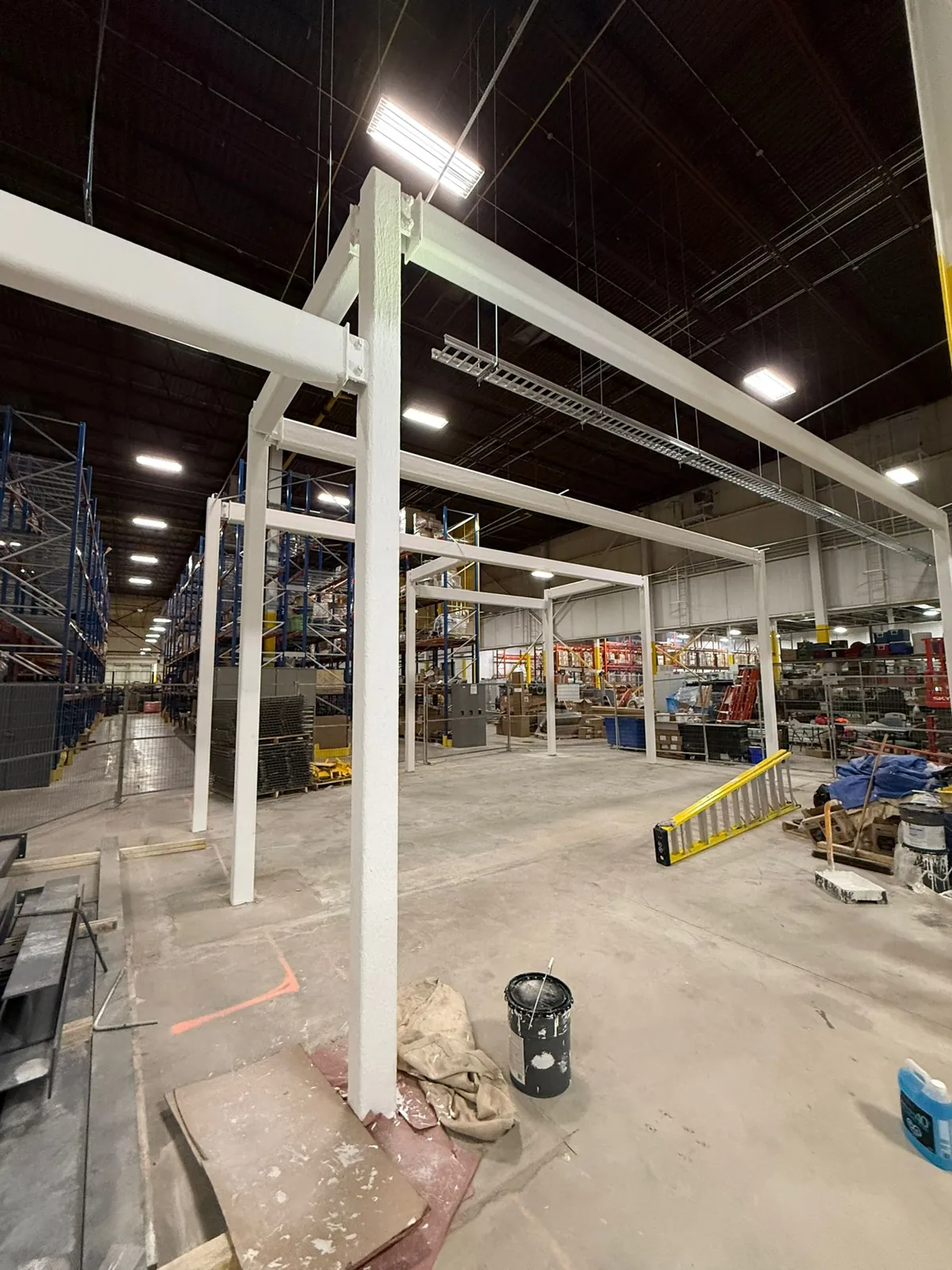 After: steel frames coated in white intumescent fireproofing